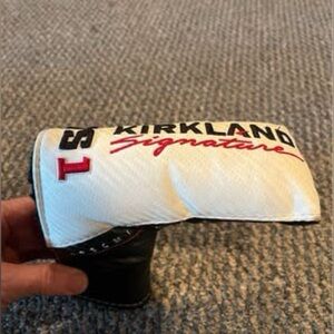 Kirkland Signature White and Black Blade Golf Putter Headcover with Red Accents.